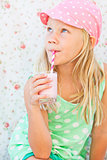 Young girl drinking smoothie