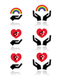 Rainbow, gay and lesbian symbols in heart with hands