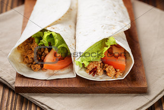 burritos with beef tomato and salad leaf