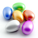 varicoloured painted eggs on a white background
