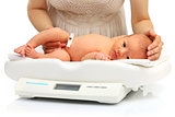 Newborn baby on a weight scale