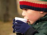 winter boy drinking cocoa