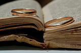 wedding rings on old book