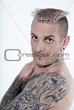 man with piercing and tattoos