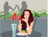 Lady sitting in a restaurant and drinking wine