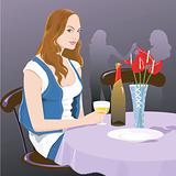 Lady sitting in a restaurant and drinking wine