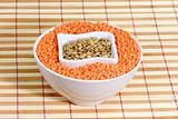 Red and yellow lentils in a white bowl