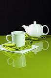 Teapot on Green Table