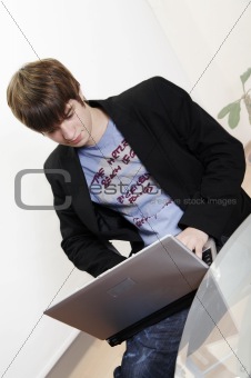 confident young manager at work with laptop