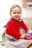 Portrait of cute baby with toy