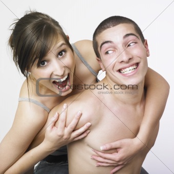 Happy young couple playing