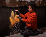 Flames of hope - homeless boy warming