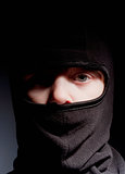 Portrait of a Boy with Hood Playing Ninja