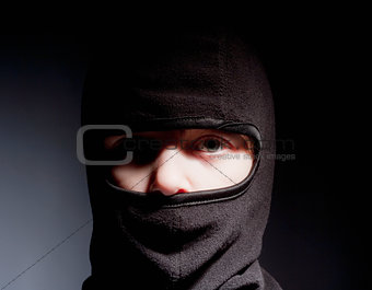 Portrait of a Boy with Hood Playing Ninja