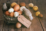 Assorted eggs in basket with note card