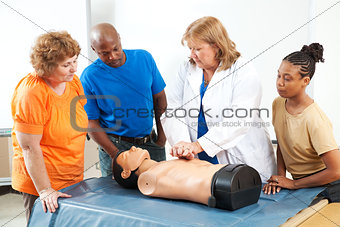 Adults Learning First Aid CPR