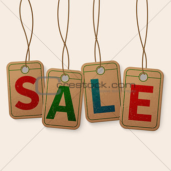 Sale tag on vintage hanging labels isolated on light cream background