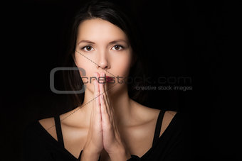 Spiritual young woman praying