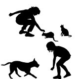 Children silhouettes playing with pets