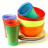 colored plastic tableware (cups, bowls, plates)
