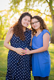 Hispanic Daughter Feels Baby Kick in Pregnant Motherâs Tummy 