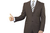 Businessman in a suit holding his thumb up