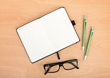 Blank notepad and office supplies