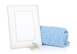 Photo frame with bath towel and boy dummy