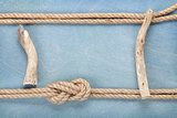 Ship rope on old wooden texture background