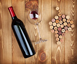 Red wine bottle, glass and grape shaped corks