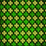 striped shamrocks in green old paper background out of focus