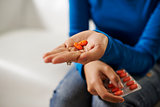 asian woman holding pills and medicine in hand