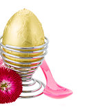 easter egg in egg holder with spoon
