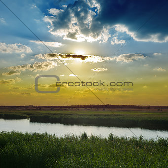 cloudy sunset over river