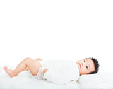 cute newborn infant baby lying down on towel