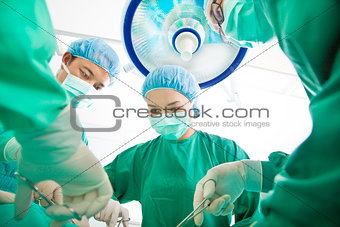 Surgeon team working together in a surgical room