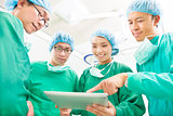 happy Surgeons discussing success operating procedure