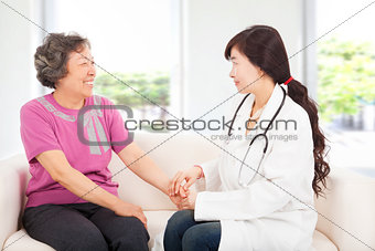 friendly doctor caring senior woman indoor room