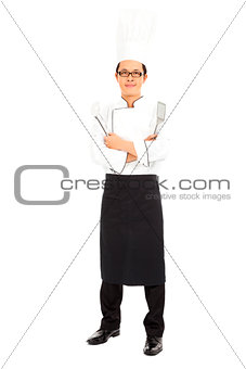 professional chef in white uniform and tools