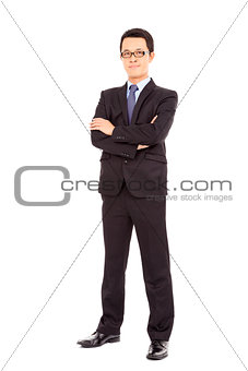 Confident businessman standing arms crossed
