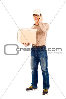 delivery man talking with cell phone and holding parcel