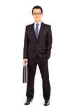 success businessman holding briefcase over white background