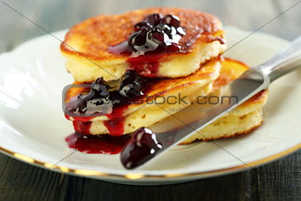 Pancakes with ricotta and cowberry sauce. 