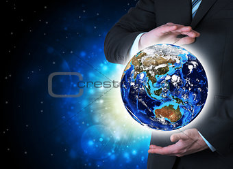 Man in suit holding a earth in hand