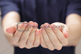 adult man cupped hands showing something