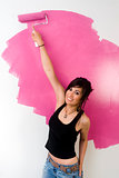 House Wife Female Works on Painting the Walls Pink