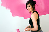 Sensual Beautiful Woman Works on Project to Paint the Walls Pink