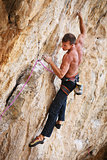 Rock climber on a face of a cliff