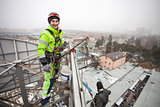 Industrial climber on top of a metal construction