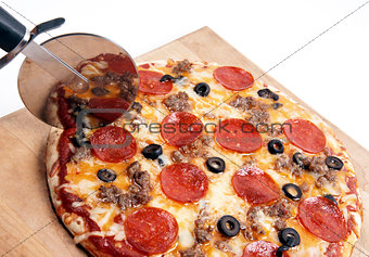 Home Backed on Wood Board Cutter Slicing Meat Pizza